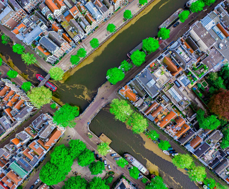 Aerial drone top down photo of Amsterdam canals with leisure boa