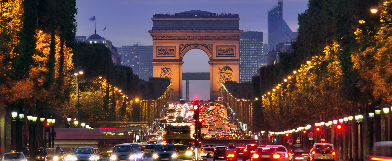 Champs Elysees and Arc de Triomphe in Paris France. night scene with car traffic