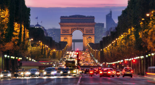 Champs Elysees and Arc de Triomphe in Paris France. night scene with car traffic