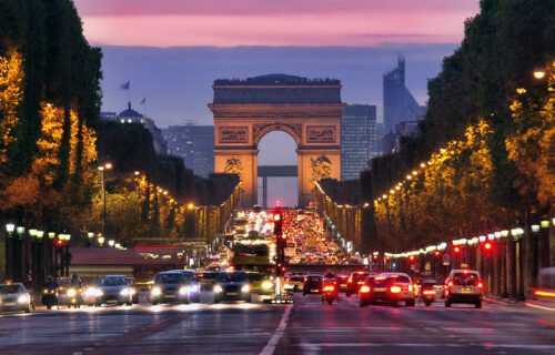 Champs Elysees and Arc de Triomphe in Paris France. night scene with car traffic